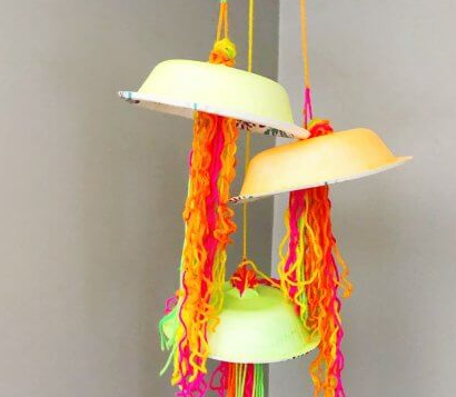 Glow in the dark jellyfish craft hanging from the ceiling