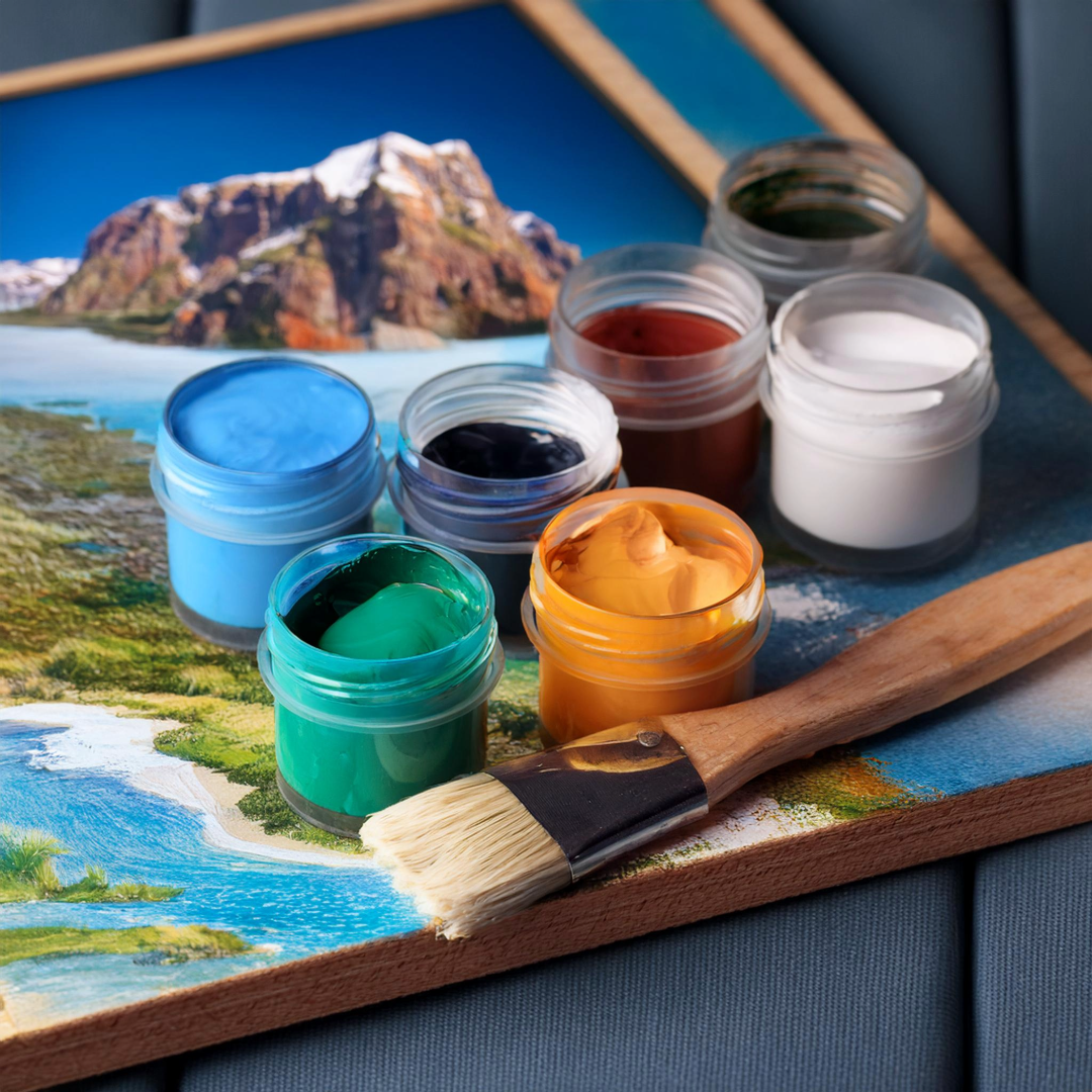 Picture of paints, brush, and mountain background.